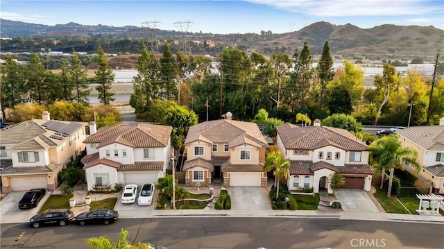 birds eye view of property featuring a mountain view