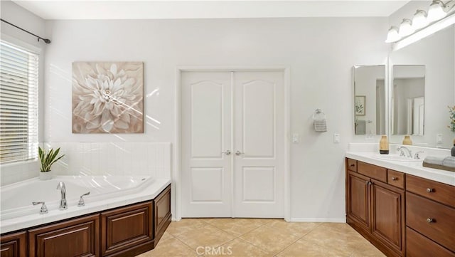 bathroom with vanity, tile patterned floors, and a bathing tub