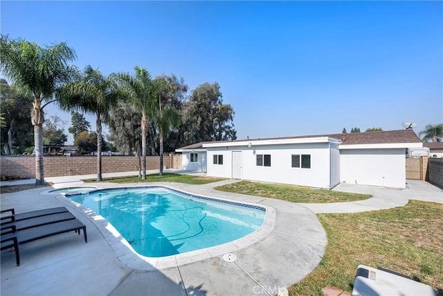 view of swimming pool with a lawn and a patio