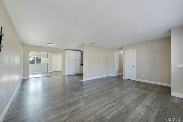 empty room with hardwood / wood-style floors