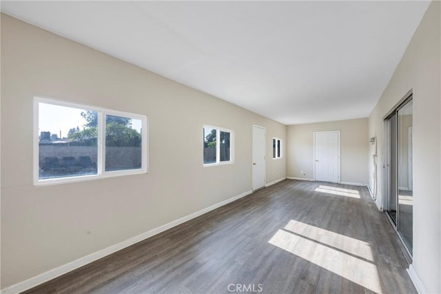 spare room featuring dark hardwood / wood-style floors