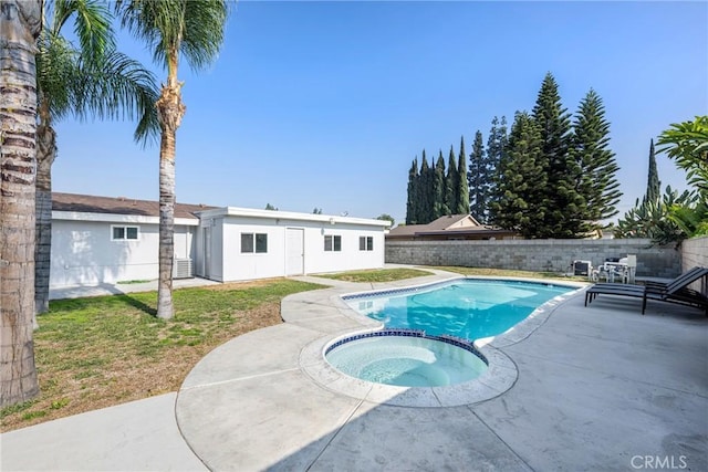 view of pool featuring a patio area and an in ground hot tub