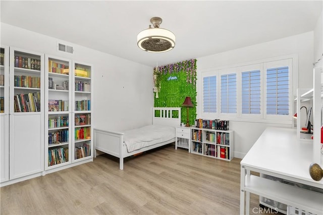 bedroom featuring light hardwood / wood-style floors