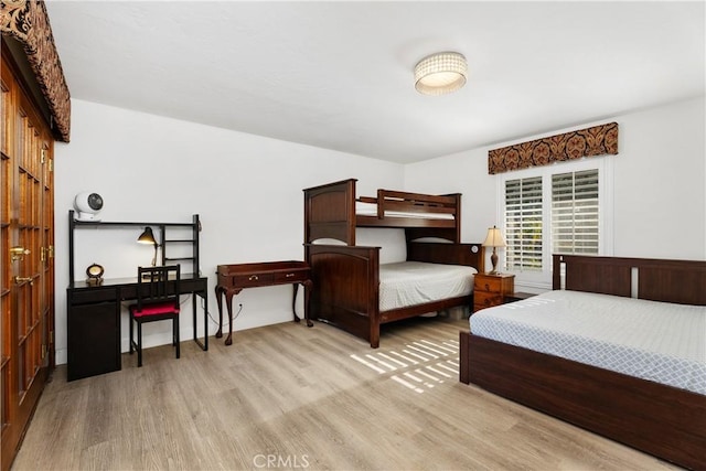 bedroom with light wood-type flooring