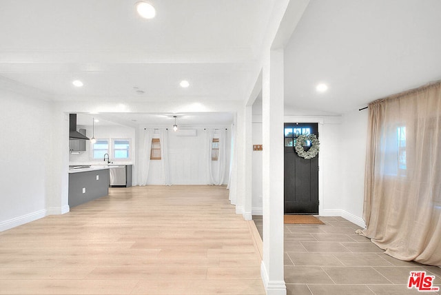 hall featuring light hardwood / wood-style flooring and sink