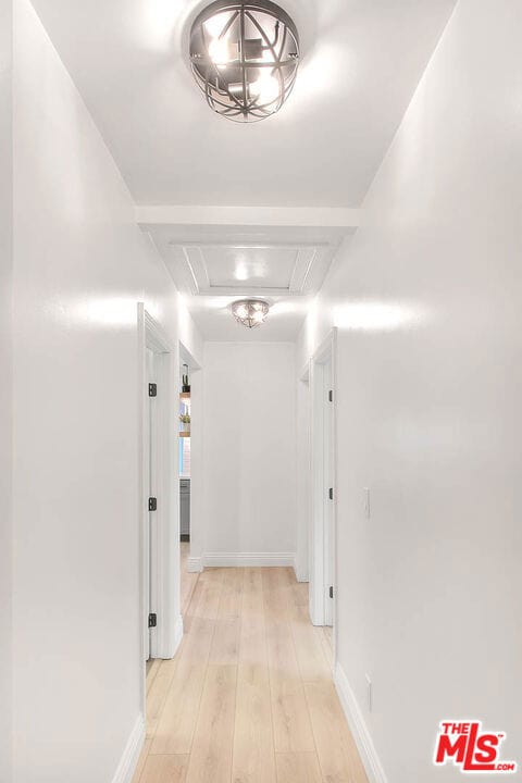 corridor featuring light wood-type flooring