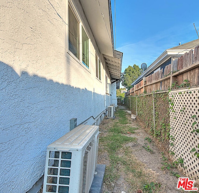 view of side of property with cooling unit