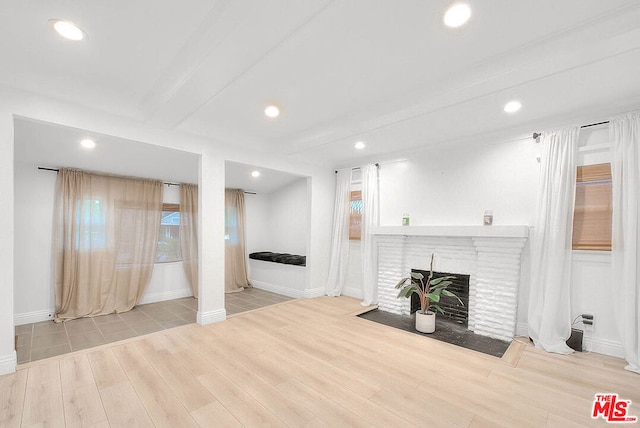 unfurnished living room featuring light hardwood / wood-style flooring