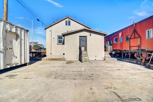 back of property with a patio area