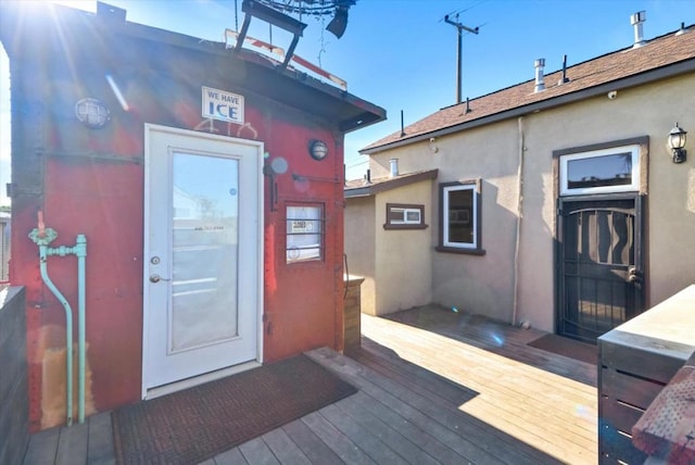 doorway to property featuring a wooden deck