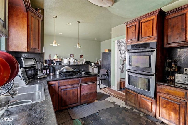 kitchen with pendant lighting, black gas cooktop, tile patterned flooring, decorative backsplash, and stainless steel double oven