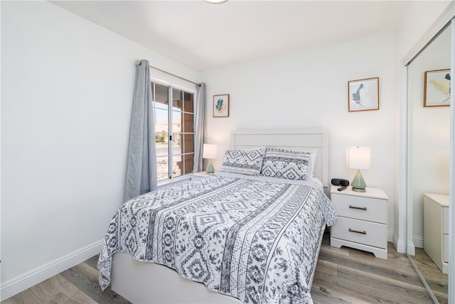 bedroom with hardwood / wood-style floors