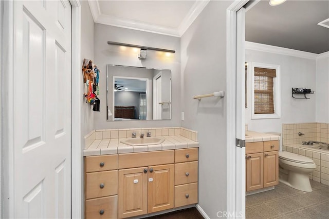 bathroom featuring tile patterned floors, vanity, a relaxing tiled tub, and ornamental molding