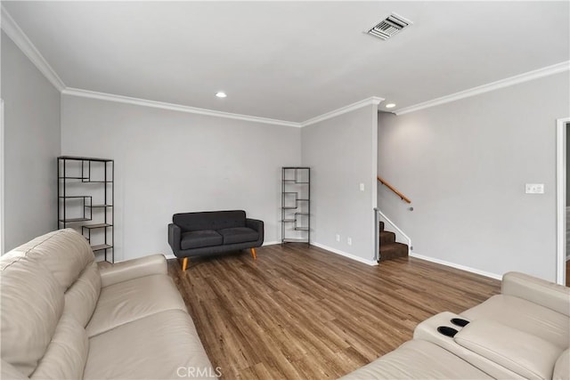 living room featuring wood-type flooring and ornamental molding