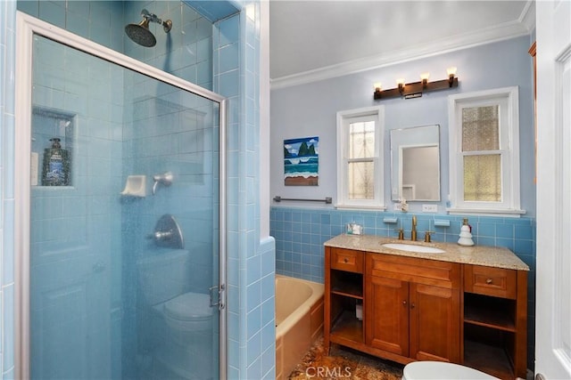 bathroom featuring vanity, independent shower and bath, tile walls, and crown molding