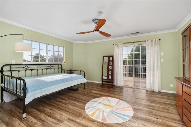 bedroom featuring hardwood / wood-style floors, ceiling fan, access to exterior, and ornamental molding