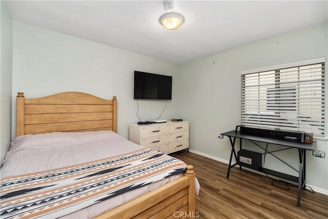 bedroom featuring dark hardwood / wood-style floors