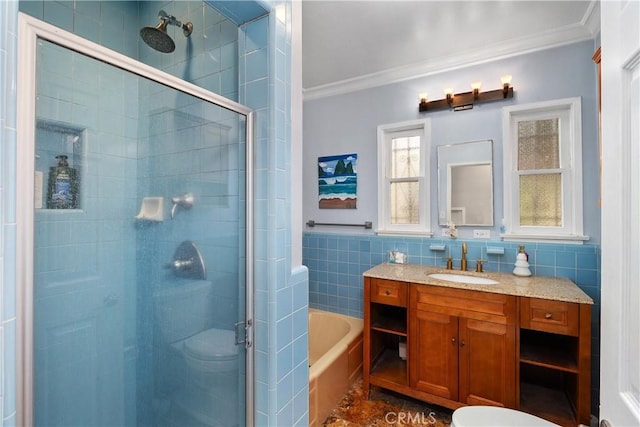 bathroom featuring vanity, independent shower and bath, tile walls, and ornamental molding