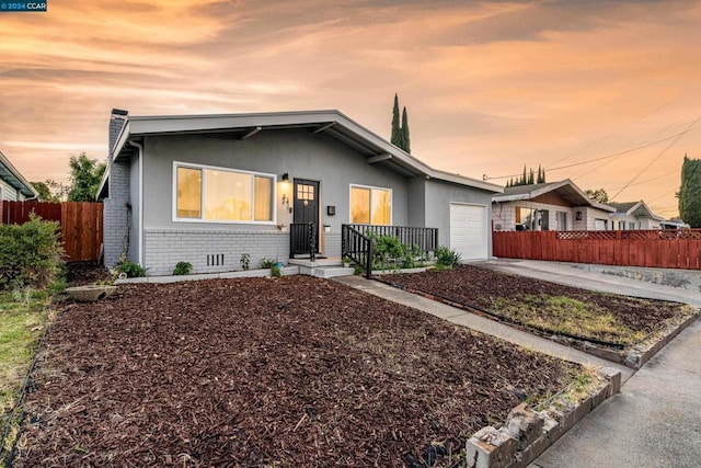 view of front of property featuring a garage