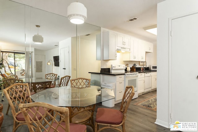 dining area with dark wood-type flooring