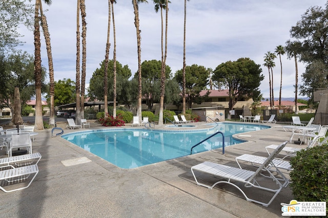 view of swimming pool featuring a patio