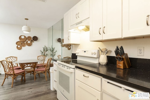 kitchen featuring hanging light fixtures, dark hardwood / wood-style flooring, ventilation hood, white electric stove, and white cabinets