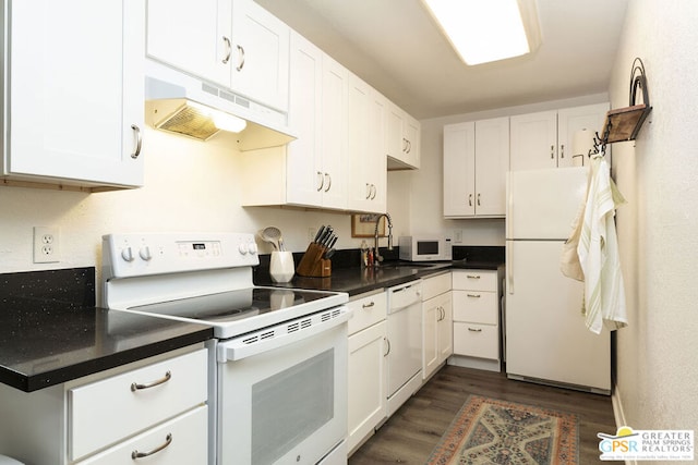 kitchen with dark hardwood / wood-style flooring, white appliances, and white cabinetry