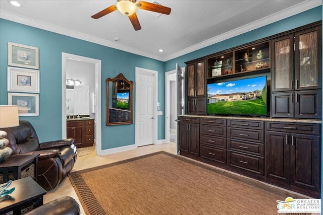 living room with ceiling fan and ornamental molding