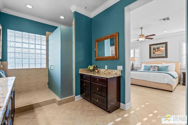 bathroom featuring vanity, a shower, tile patterned floors, crown molding, and ceiling fan