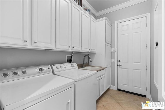 laundry area with cabinets, ornamental molding, sink, light tile patterned floors, and independent washer and dryer