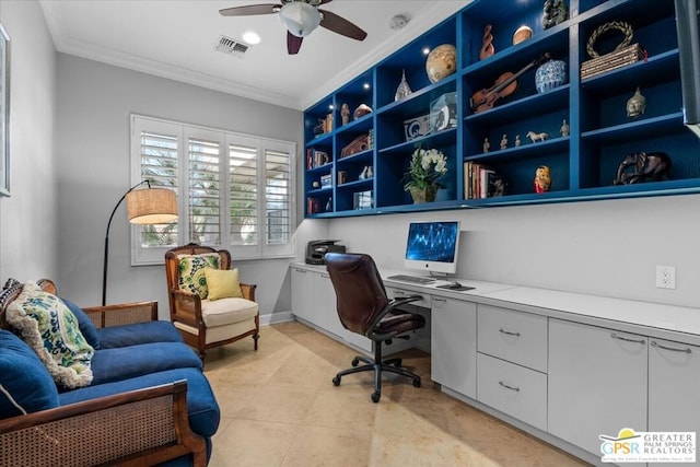 home office featuring ceiling fan, built in desk, and crown molding