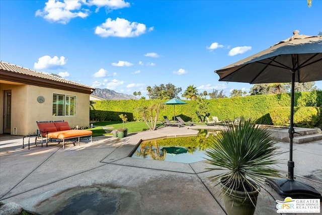 view of patio featuring a mountain view