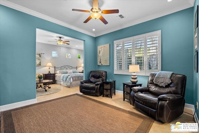 bedroom with ceiling fan and crown molding