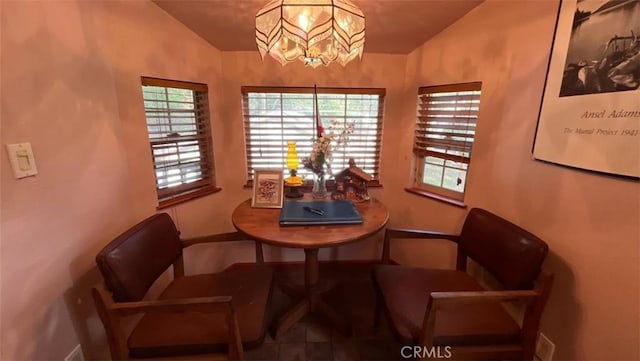 dining area with an inviting chandelier