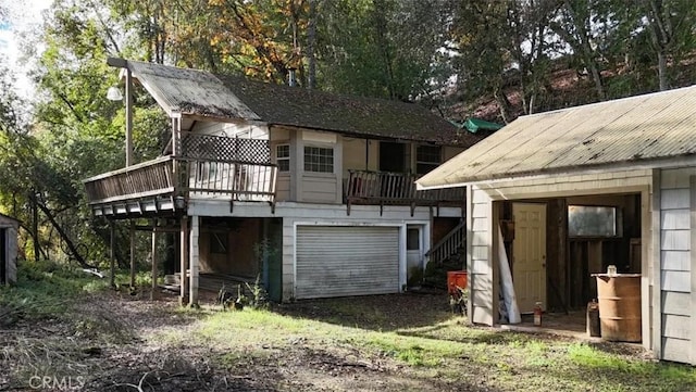 rear view of house with a wooden deck