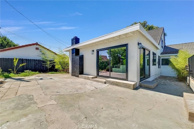 rear view of property with a patio area