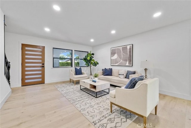 living room with light hardwood / wood-style flooring