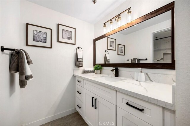 bathroom with tile patterned floors and vanity