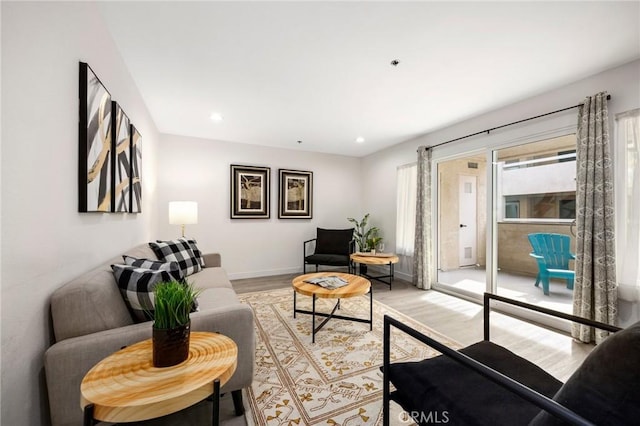 living room with light hardwood / wood-style floors