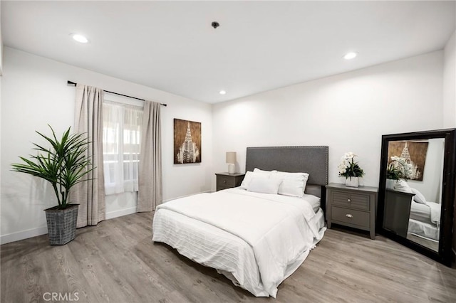 bedroom with light hardwood / wood-style floors