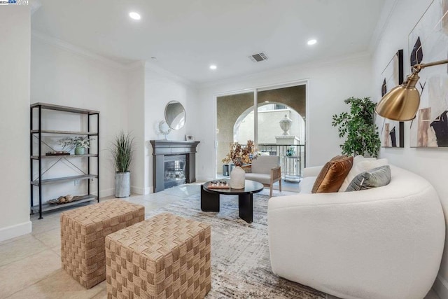 living room featuring light tile patterned floors and crown molding