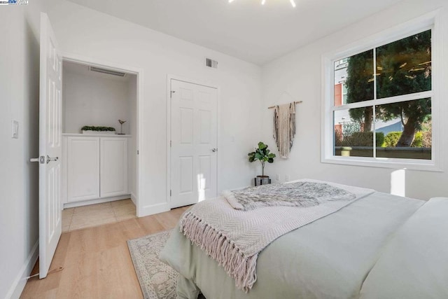 bedroom with light wood-type flooring