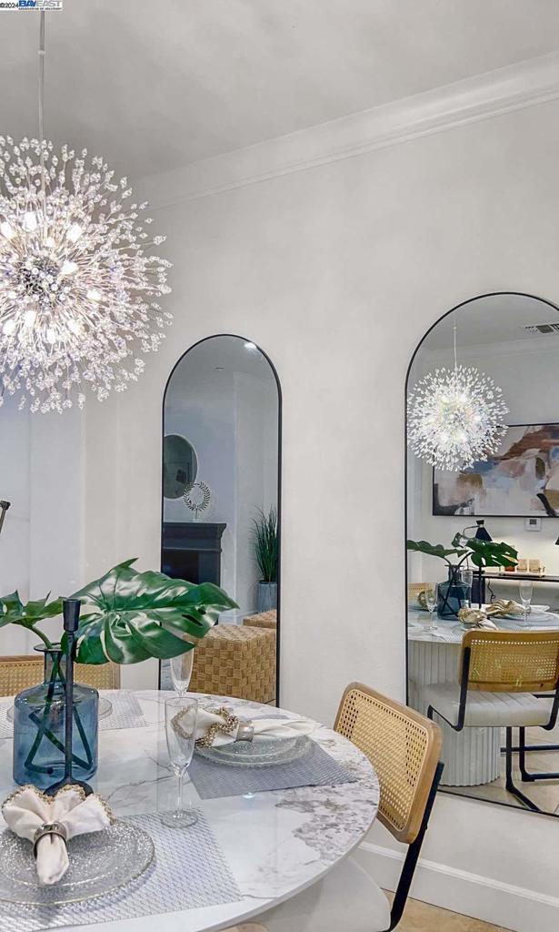 dining area with a chandelier and ornamental molding