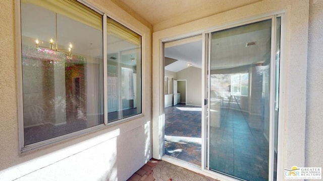 doorway to property featuring a balcony