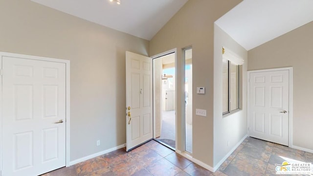 entryway with vaulted ceiling