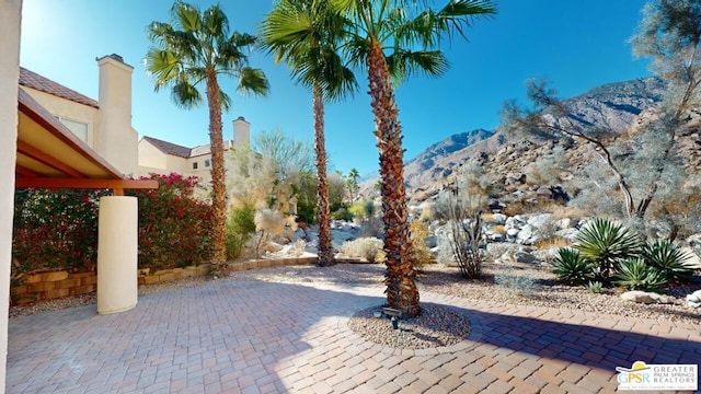 view of patio / terrace with a mountain view