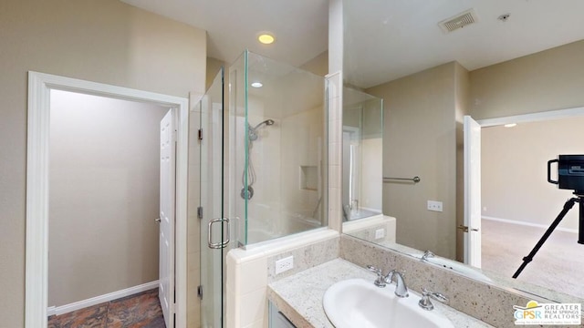 bathroom featuring vanity and walk in shower