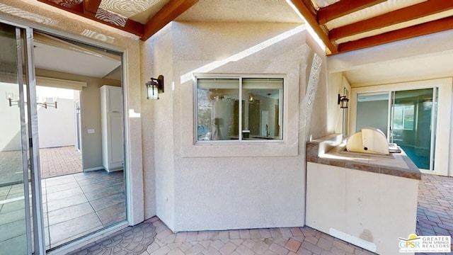 exterior space featuring a patio and an outdoor kitchen