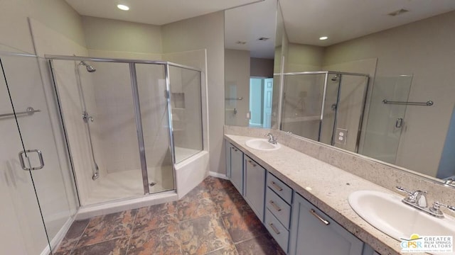 bathroom with vanity and an enclosed shower