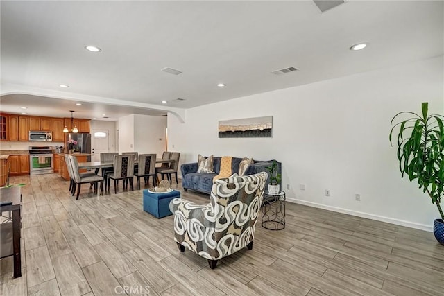 living room with light hardwood / wood-style floors